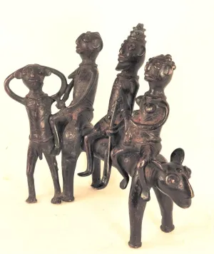 A king and two ladies on a two-headed beast